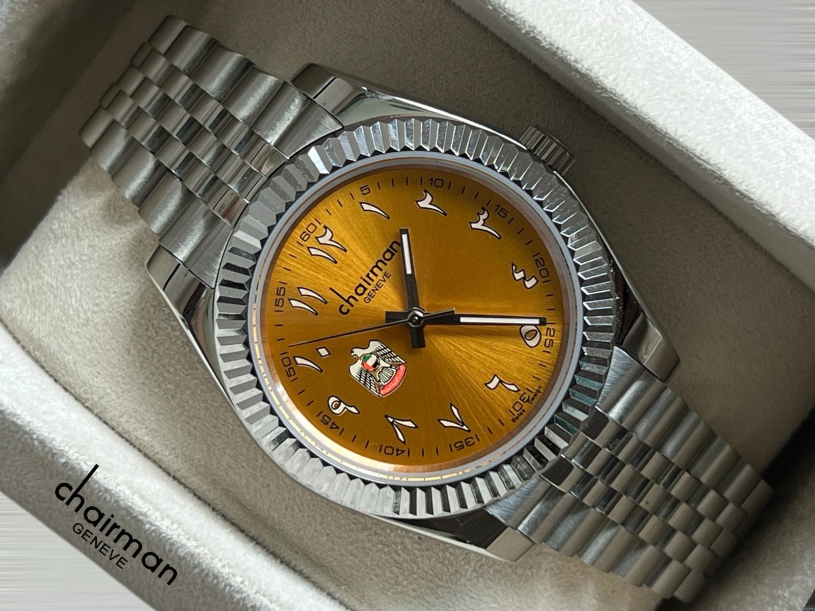 ABU DHABI Emblem Chairman Geneve Orange Arabic Dial Silver Chain Gents Watch